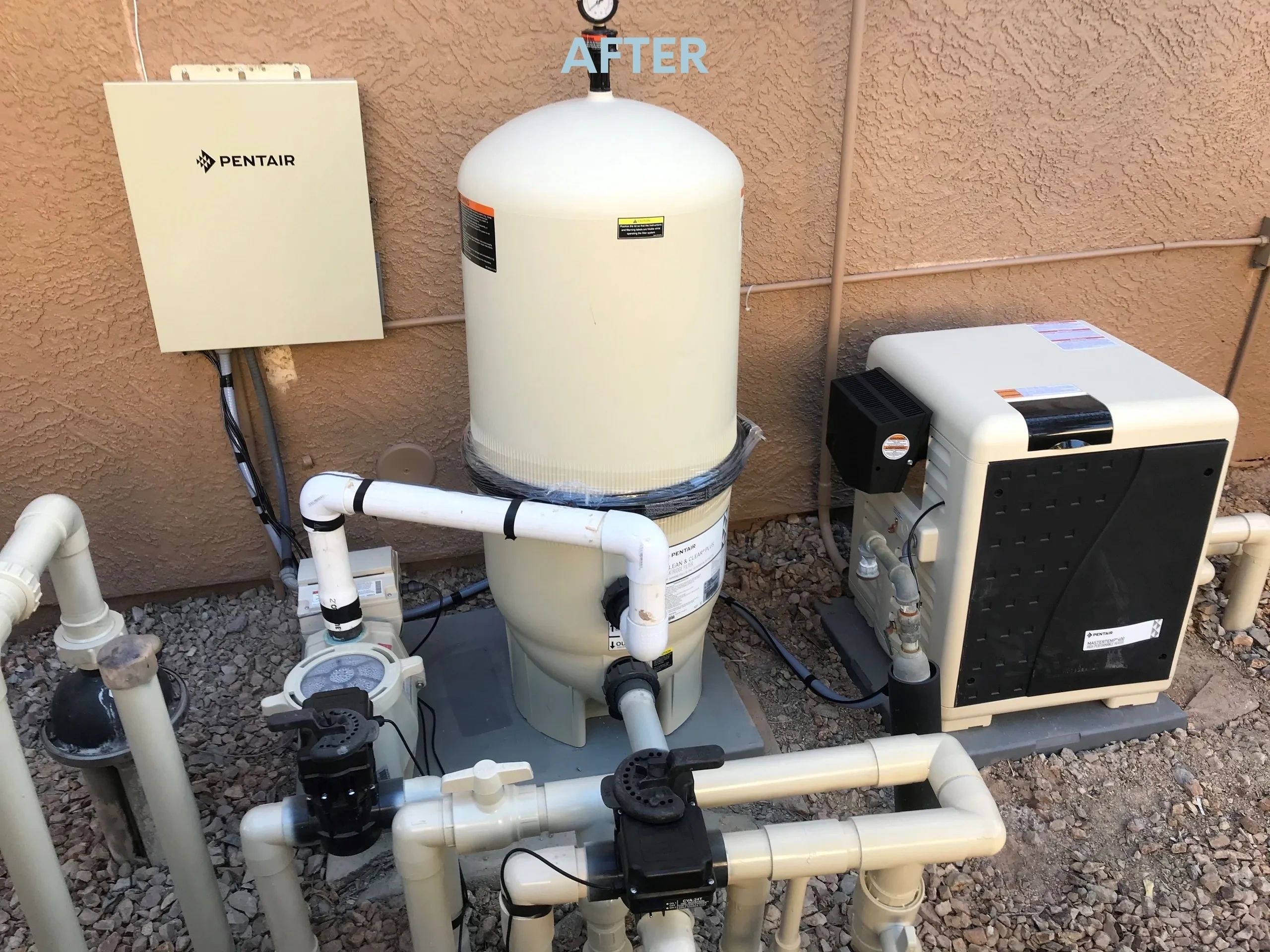 A pool heater and pump outside of a building.